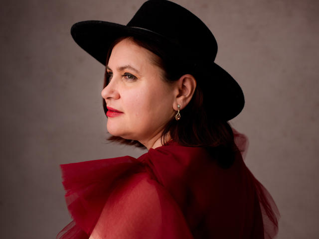 Digital art of several stylized, flat, three-dimensional, red and white flame-like shapes. The shapes are evenly spaced, with a slight gradient from red to white. Simple, minimalistic design.