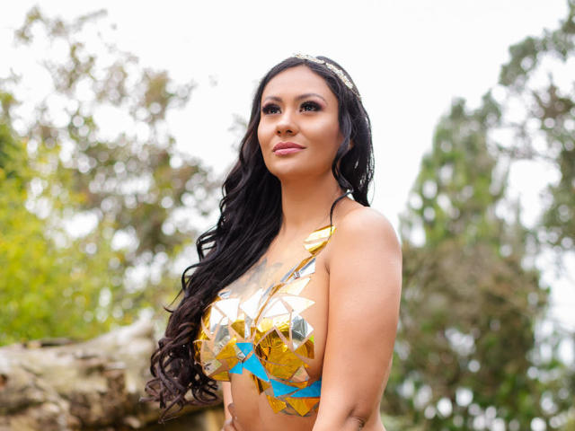 Digital illustration of multiple European-style flags with bold, solid colors. Flags are arranged in a semi-circle with subtle shadows. Flags have geometric shapes and simple, clean lines.