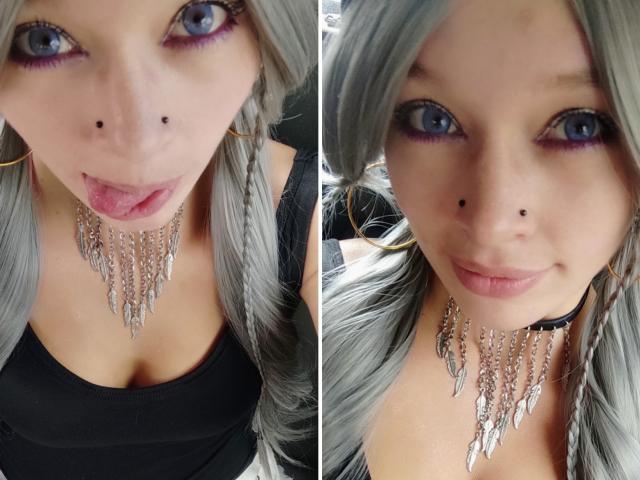 GoddessLufe heeft grijs haar, blauwe ogen en een neusring. Ze draagt een zwarte top met een ketting en steekt op één foto haar tong uit..
