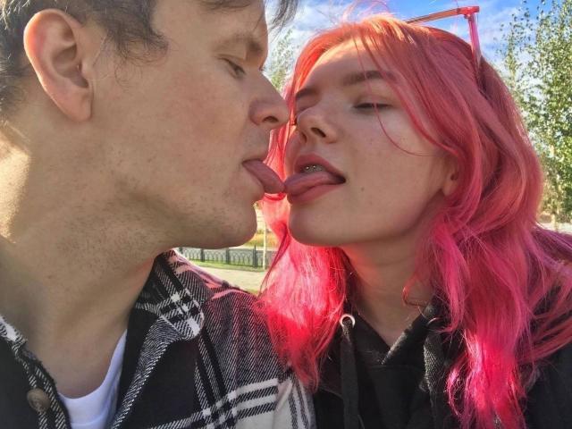 ChillOutt with pink hair and ChillOutt with brown hair are tongue-kissing. Pink-haired ChillOutt has tongue out, brown-haired ChillOutt's tongue is touching pink-haired ChillOutt's tongue.