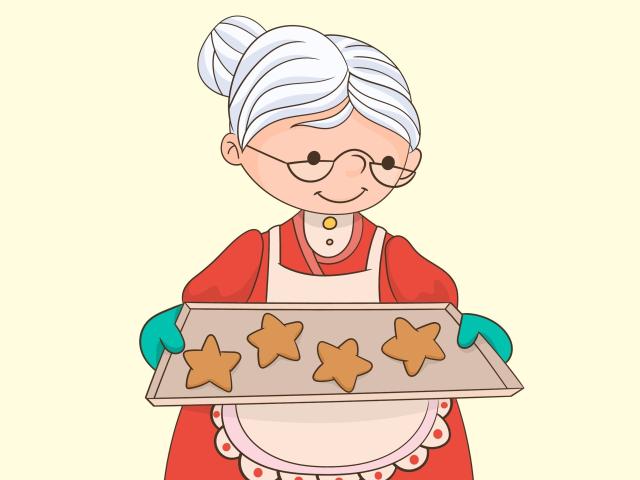SuperbissimaTroiana, com cabelo branco preso em um coque, óculos, vestido vermelho, avental branco, luvas verdes, segurando uma bandeja de biscoitos em formato de estrela, sorrindo..