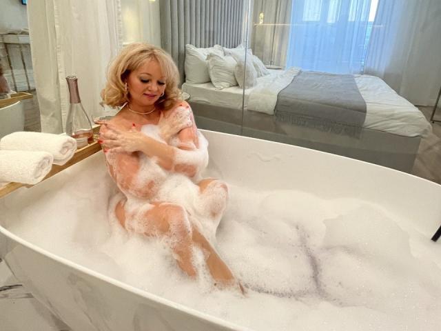 Digital art of a flat, stylized coat of arms with a red, white, and blue design. Simple, geometric shapes. Light shadowing. No text or background elements. Marmeladka69 is not present.