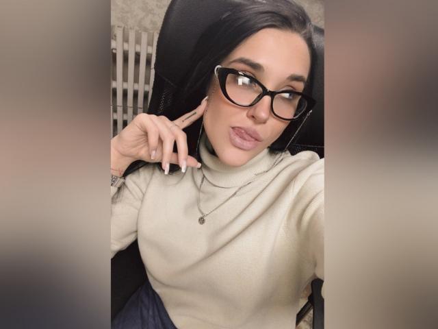 A digital illustration of a stylized, flat, geometric logo with a bold, black outline and a soft, pinkish-red interior. The design is simple and modern. IngritBerry not visible.