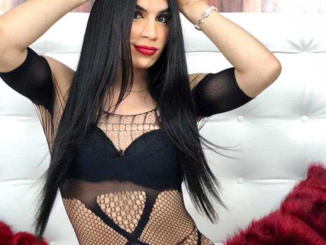 Digital art of a bold, minimalistic design featuring a large, flat, white letter "V" with a red accent in the bottom right corner. Simple, clean lines, flat colors.