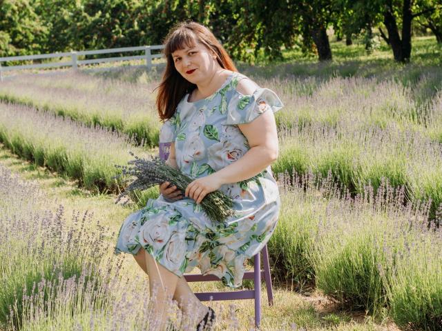 A graphic illustration featuring a large, stylized "B" in the center, surrounded by a bold, black outline. The "B" has a subtle gradient from dark to light.