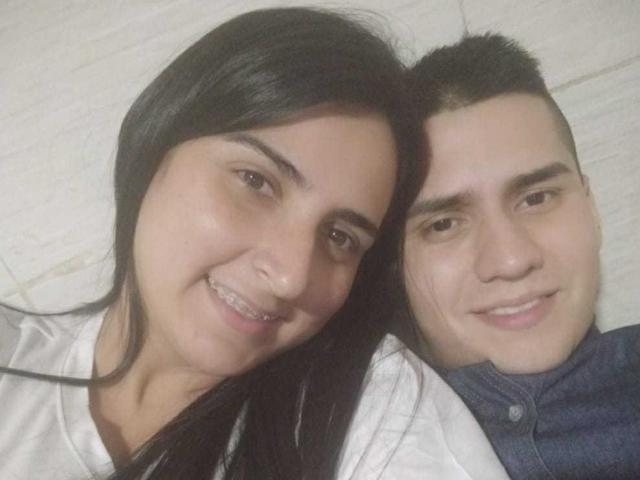 KingaNDher with long black hair and small tits, smiling next to KingaNDher with short black hair and a cute butt, wearing a blue shirt, in a selfie.