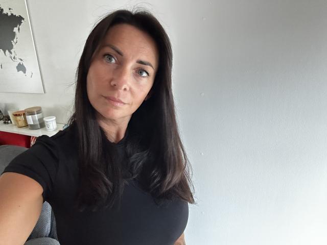 Stylized, flat-design, red-and-white, 3D, geometric, minimalistic, lantern-like object with a small, black, circular emblem on the top-left. Clean, modern lines, simple color palette. Bright, even lighting.