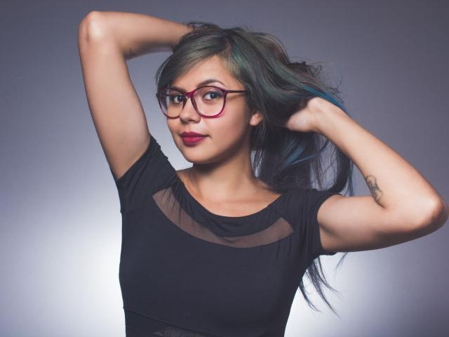 Digital art of a stylized, minimalist lantern with a soft pink glow, centered with a small, dark red flame. Simple, clean lines, flat colors. Lantern has a small, subtle handle.