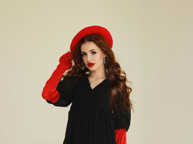 CherylFoxy with red hat, red gloves, black dress, long red hair, red lipstick, holding hat, earrings, pale skin, standing, sexy, stylish, looking at camera, full body shot.