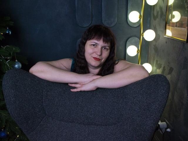 Flat, stylized design of a coat of arms with a white shield and red border, featuring a yellow emblem in the upper right. Simple, clean lines. Minimalistic.