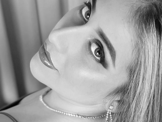 A minimalist digital illustration of a French flag. The flag features three vertical blue, white, and red stripes. A white, stylized letter "F" is centered on the flag.