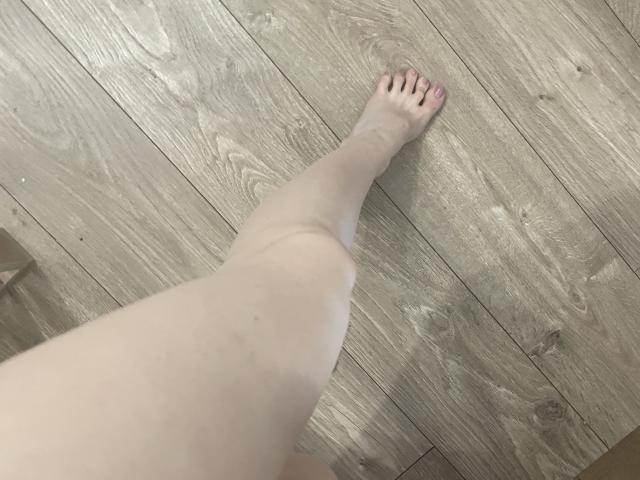 Close-up of a coat of arms with a bold, white design on a dark background. The arms feature a simple, symmetrical layout with a central emblem. Minimalistic, clean style.