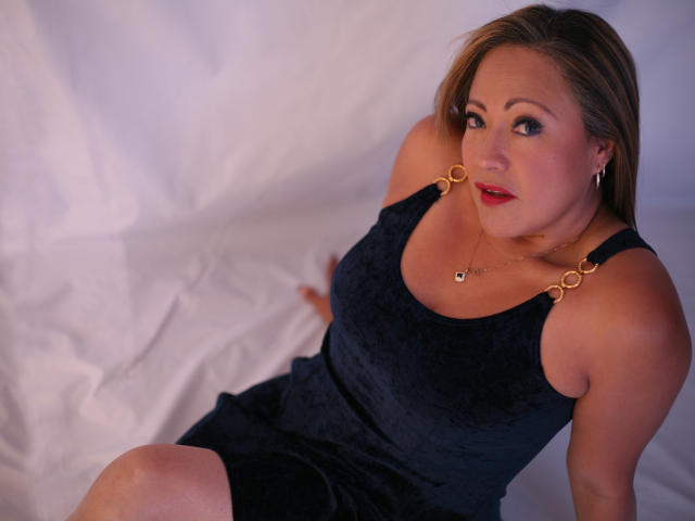 Three-dimensional, flat-style emblem with bold red, white, and black colors. Central emblem features a red cross-like shape. Simple, geometric lines. No textures or gradients. Clean, minimalist design.