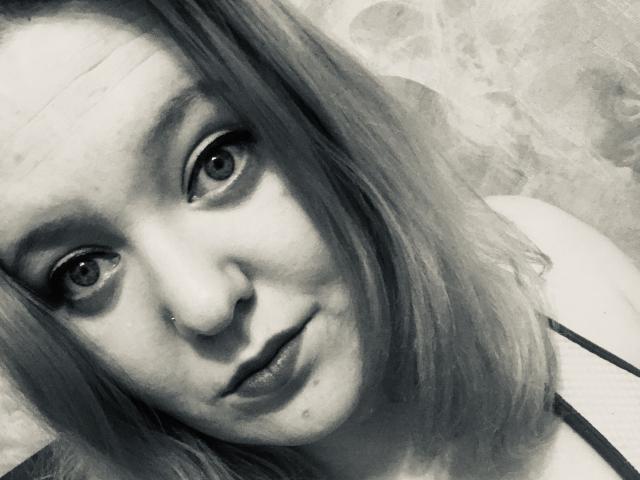 A close-up of a stylized coat of arms with a bold, white, five-pointed star in the center. The star is surrounded by a thin, dark border.