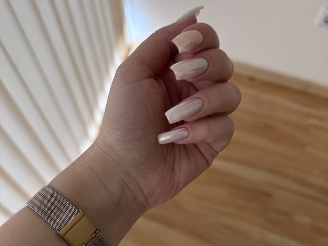 A flat, minimalist-style illustration of a large, white, blocky letter "E" in the center. The "E" has bold, black outlines and a simple, solid color fill.