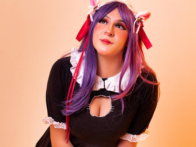 KittyEla with purple hair, cat ears, black dress, white ruffle collar, cutout, and lace, leaning forward, looking up, smiling, red ribbons in hair, cute, sexy.