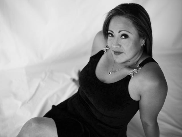 Digital illustration of five white, stylized letter "A"s stacked vertically, centered. Each "A" is slightly larger than the one below, with a minimalist, modern design. Simple, clean lines.