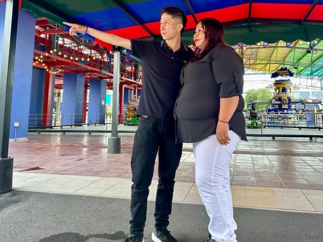 Digital illustration of a stylized red Soviet-era hammer and sickle with bold, flat colors. The hammer is on the left, sickle on the right, with a central red star.