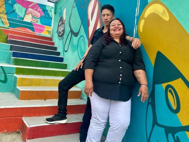 Geometric-style illustration of a stylized, abstract letter "A" in bold colors. Bright red, yellow, and blue shapes form the letter, with clean lines and flat colors. Modern, minimalist design.