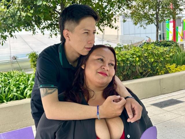 Digital illustration of a modernist style. Central dark red geometric shape. Surrounding green patterned blocks. Light blue and white rectangular shape in bottom right. Minimalist, abstract composition.