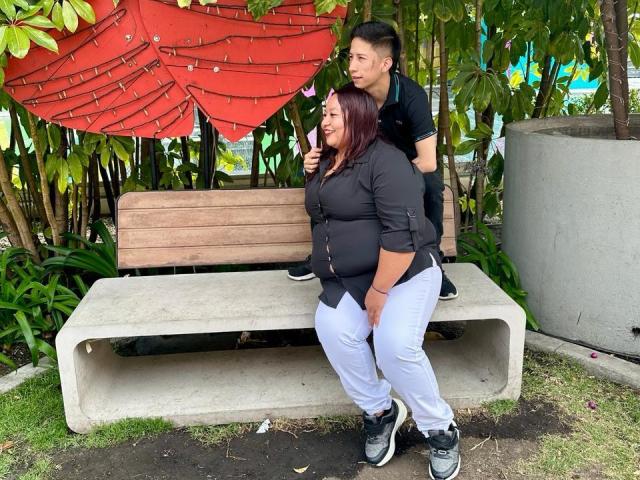 Abstract illustration with bold, flat colors. Red and green shapes in the upper left, large black and white "B" in the center, and green pattern at the bottom. Minimalist style.