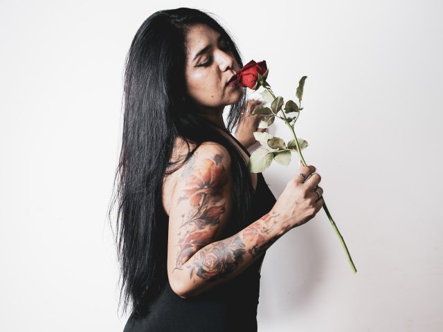 Korean-style paper lanterns in a row. Red and black lanterns with traditional Korean designs, stacked vertically. Soft shadows, subtle gradients. Simple, elegant composition. Minimalist, cultural motif.