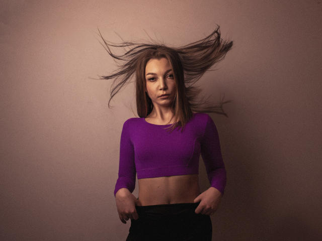 A detailed, flat-style emblem with a bold, dark outline. Centered, a large, lighter-colored letter "D" dominates the design. Simple, geometric shapes and clean lines define the emblem.