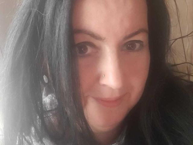 Flatter, stylized coat of arms with a bold, red center and lighter red edges. Simple, symmetrical design. No additional elements or textures. Clean, modern aesthetic.