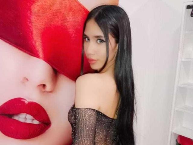 Three red Korean flags with black trigrams, stacked vertically. Flags have bold, horizontal lines and triangular patterns. Center flag is slightly larger. Simple, geometric design. Red and black colors dominate.