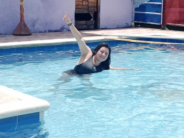 Flatter-style illustration of a red, stylized letter "R" with a black, curved line through it. Minimalist, bold colors. Centered, with a slight shadow beneath the letter. Simple, clean design.