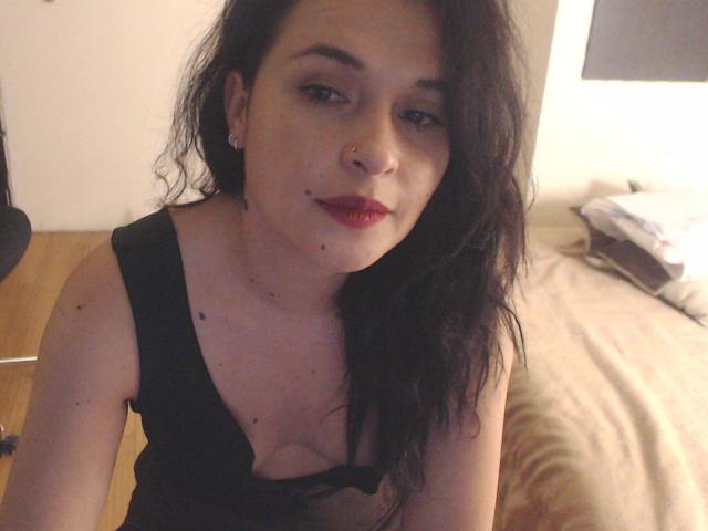 Multiple flat, white, and brown, ornate-style, geometric, coat-of-arms or heraldic symbols stacked vertically. Bold, symmetrical, and minimalist design. Simple, clean lines. No texture or shading.