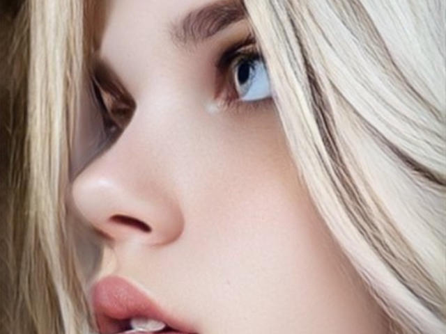 JoannLowe's face, blonde hair, blue eyes, fair skin, slightly open mouth, looking to the side, nose, soft light, subtle makeup, focused, delicate features, subtle smile, gentle expression.