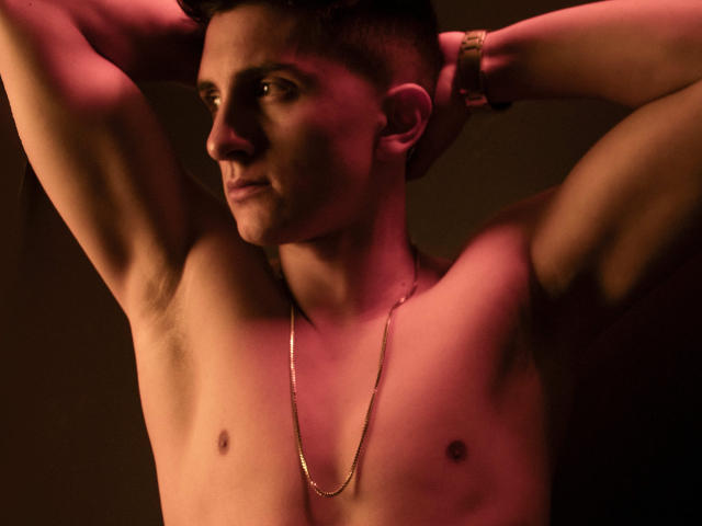 Digital art of a small, stylized flame logo with a red-orange gradient, centered in the image. Simple, flat colors, minimal shading. Clean, geometric lines. RagnarkLordBrok not present.