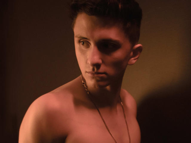 A minimalist, flat-style illustration of a red, wax-sealed letter with a white, flame-like wax mark on top. Simple, bold colors and clean lines. RagnarkLordBrok not visible.