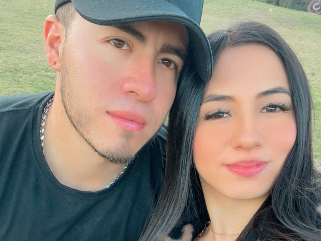 SexyCoupple: a cute, light-skinned dude with a black cap and chain, next to a sexy, light-skinned chick with long black hair and pink lipstick, both smiling.