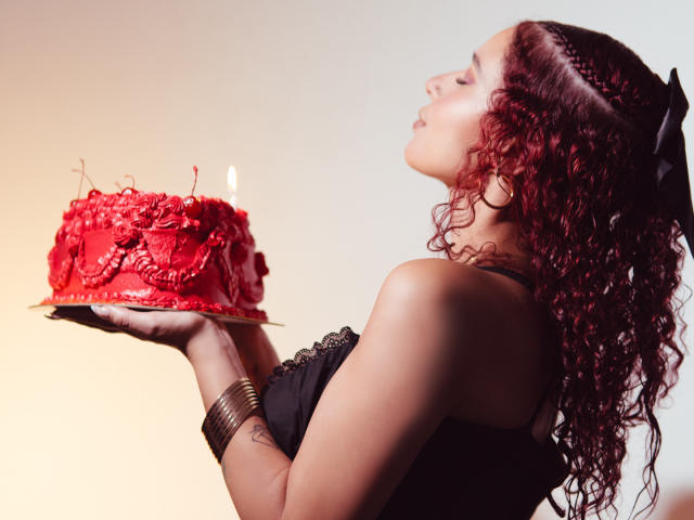 Minimalist style, flat colors. Red and white "L" lettering in lower left, red "L" logo in upper right. ValeryScot not present. Simple, clean lines, bold shapes.