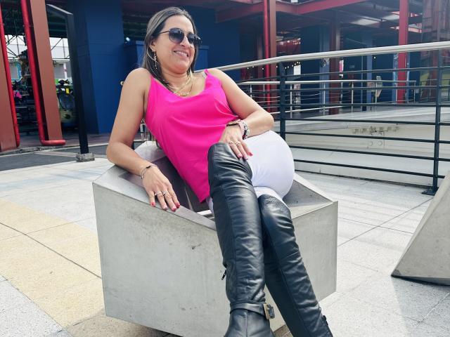 Digital illustration of a stylized, red Korean flag with black letters, positioned in the lower right corner. Light gray background. Clean, bold lines. Simple, minimalist design. Flat colors.