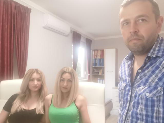 Three people in a room, DiaToDajla with blonde hair in a green top, DiaToDajla with blonde hair in a black top, DiaToDajla with brown hair in a blue shirt.