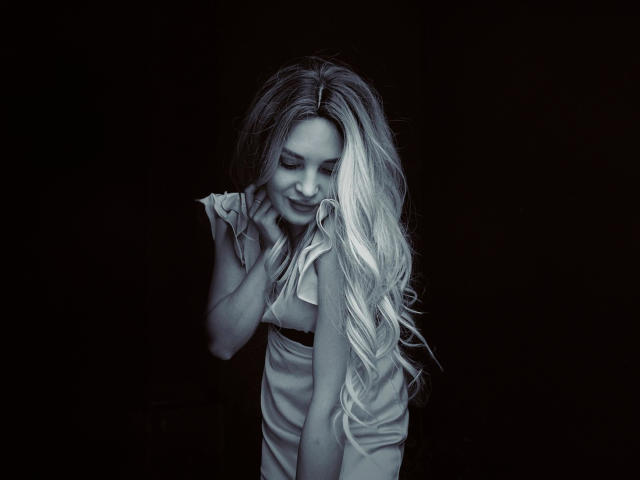 A detailed, stylized emblem with a central, partially visible letter "E". The emblem features bold, symmetrical lines and a muted color palette, emphasizing simplicity and elegance.