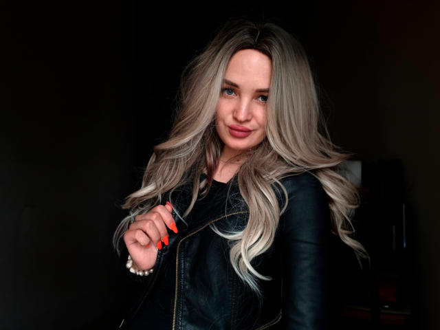 Digital illustration of a red and white paper lantern with a decorative ribbon, centered. Simple, flat colors. Ornate ribbon detail. Lantern slightly angled. Minimalistic style. No text or watermarks.