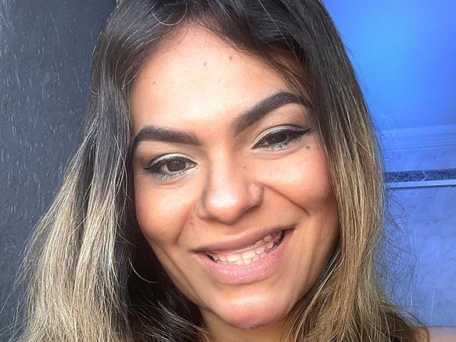 Digital art of a blurred, ribbon-like pattern with a large, central, soft pink and white gradient circle. Simple, flat colors. Ornate, decorative style. No textures or detailed elements.