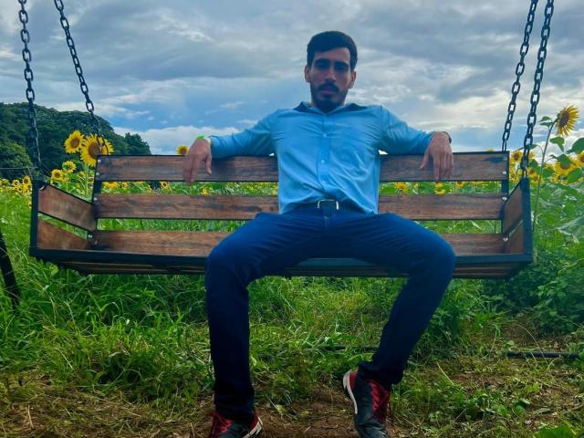 A digital illustration of a Soviet-era hammer and sickle with a red star above, in bold, flat colors. The hammer and sickle are centered, with the star slightly above.