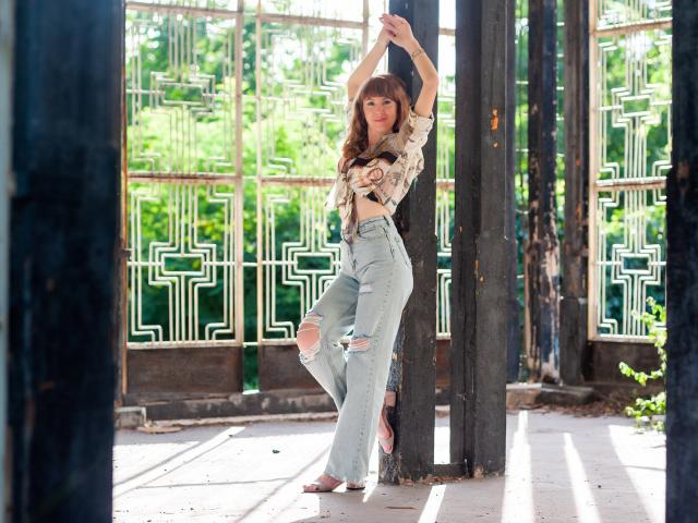 Digital art of a bold, geometric logo with a red and green color scheme, featuring stylized letters and a central emblem. Clean lines, modern design, flat colors.