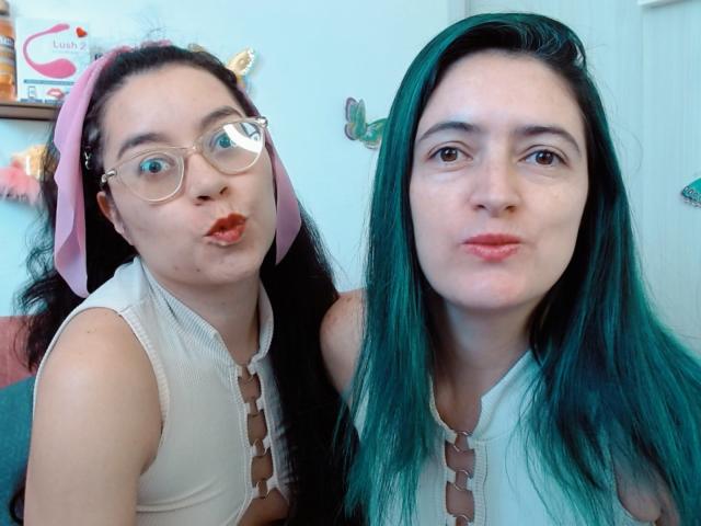 Digital illustration of a minimalist, flat-style design featuring a large, bold letter "V" in the center. Soft gradient colors with a light pinkish-red and dark gray. Simple, clean lines.