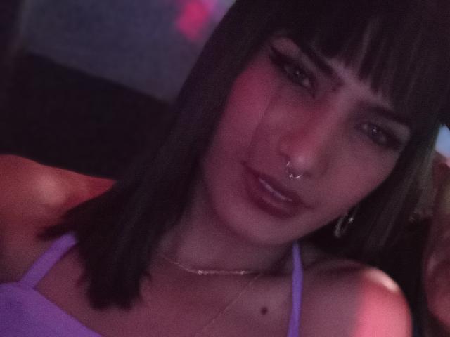 Lunardy's faceless silhouette holds five red, rectangular paper fans. Fans are evenly spaced, slightly overlapping. Paper fans are centered, creating a balanced composition. Simple, clean lines dominate the image.