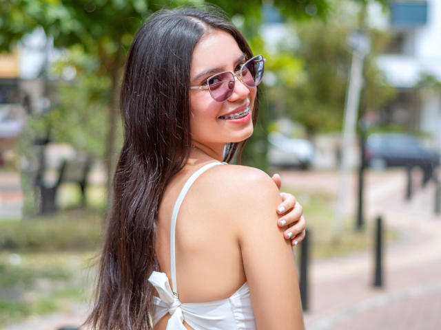 Digital art of a stylized coat of arms with a blurred effect. Central red and white emblem, thin black lines, and subtle gradient colors. Modern, minimalistic design.