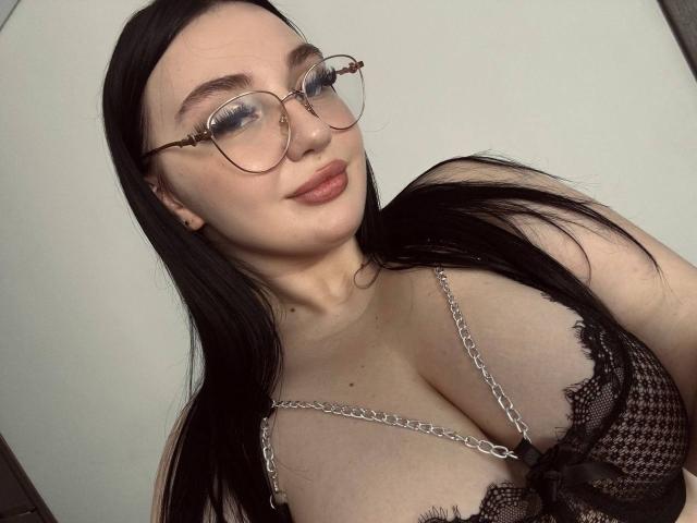 Minimalist-style illustration of a large, flat, pale pink and black letter "L" with subtle textures. Simple, clean lines dominate the composition. The letter has a slight 3D effect.