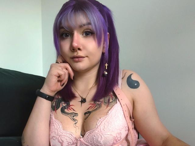 Flat, bold lettering in the center with a dark blue "A" and light pink "E". Letters have a slight 3D effect. Color gradient from dark blue to pink.