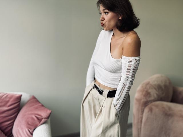 Digital illustration of two red and white French flag-style shapes, positioned diagonally with a striped pattern in the lower right. Simple, bold colors, clean lines. Minimalist style.