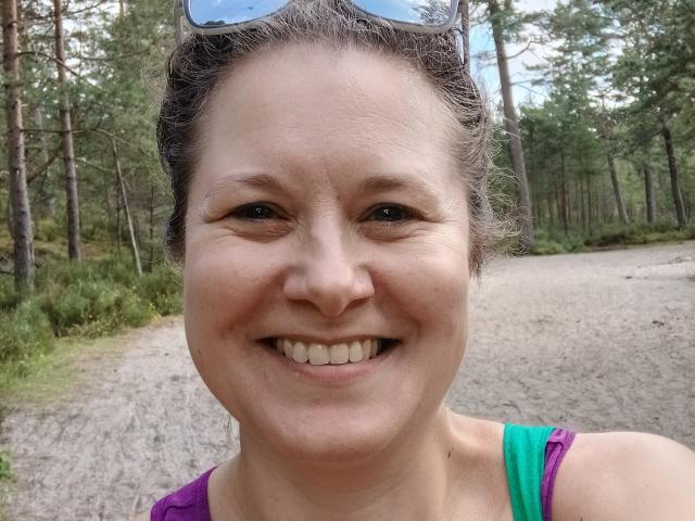 Digital art of a medieval-style flag with a large, bold, white letter "V" on a red background. Simple, flat colors, and clean lines. FlirtYolivia not present.